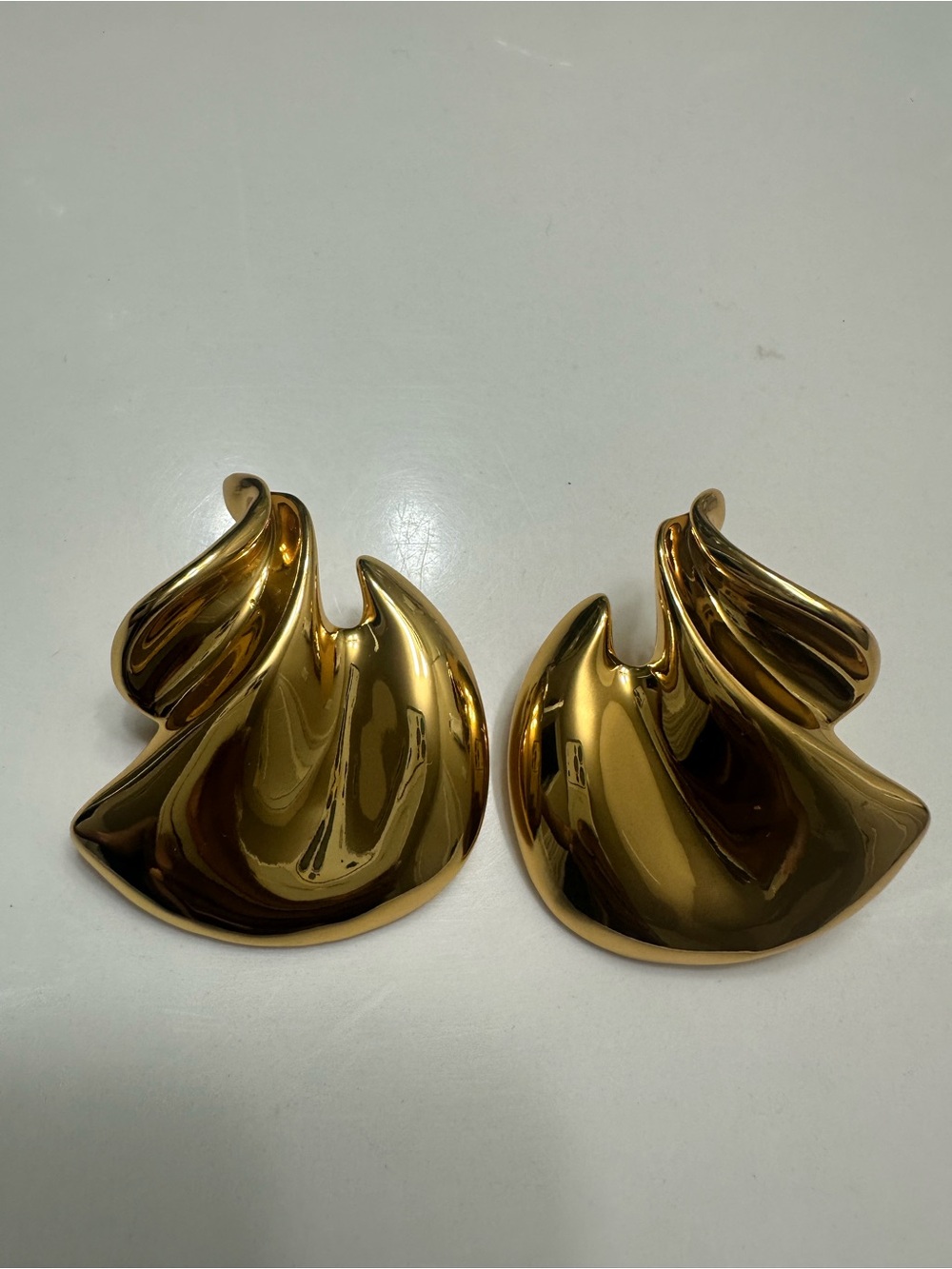 💫 Saint Laurent Elegant Gold Swirl Clip-On Earrings
